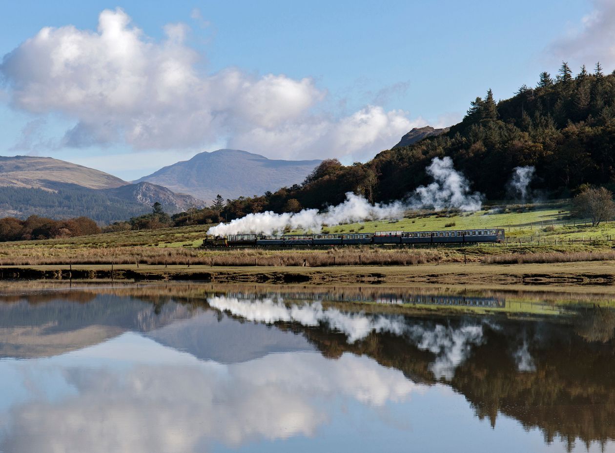 A steam train reflected on the estuary at the Ravenglass and Eskdale Railway