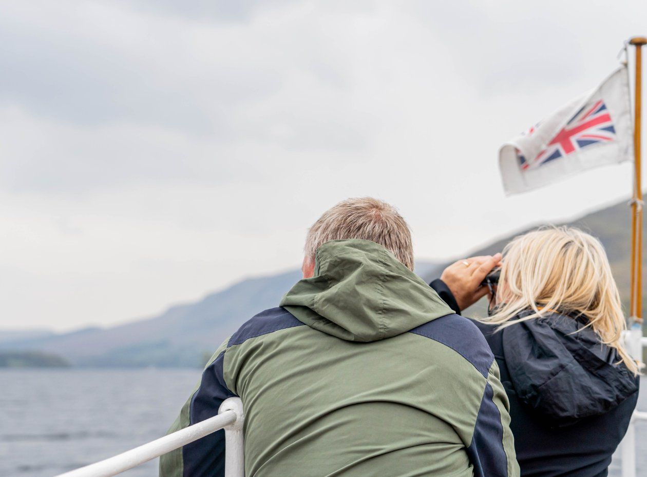 A couple enjoying a car-free journey aboard Ullswater 'Steamers' heritage boats